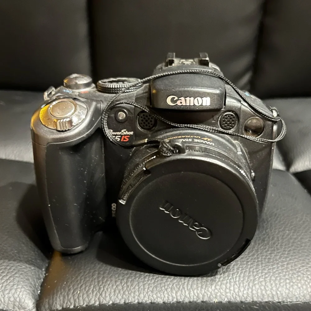 canon powershot s5 is with 2 lens covers and bag